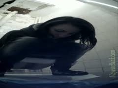 Despite seeing the camera, the adorable young brunette girl continues to urinate.